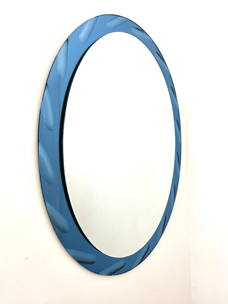 Fontana Arte Oval bevelled edge mirror.